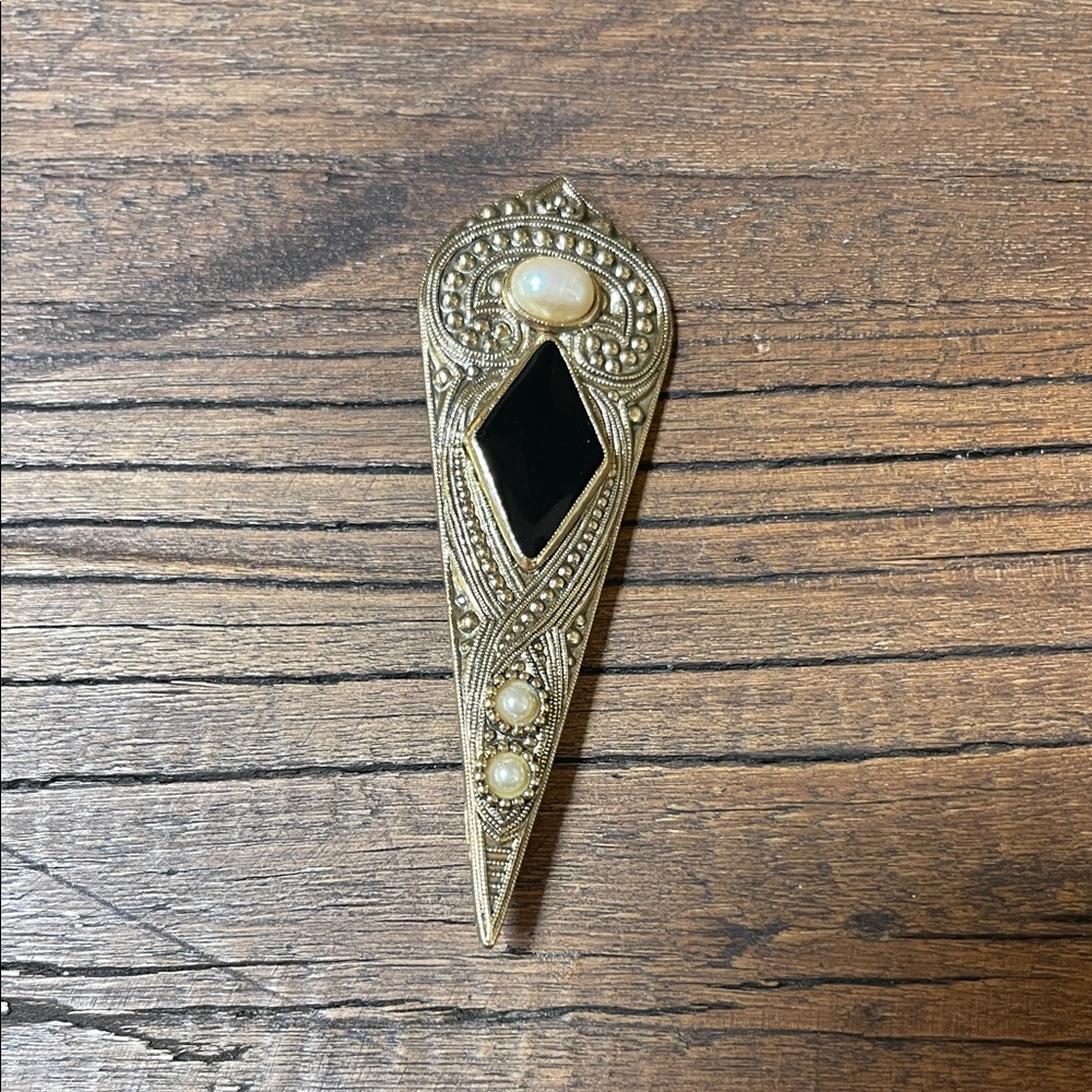 Vintage gold tone pin.